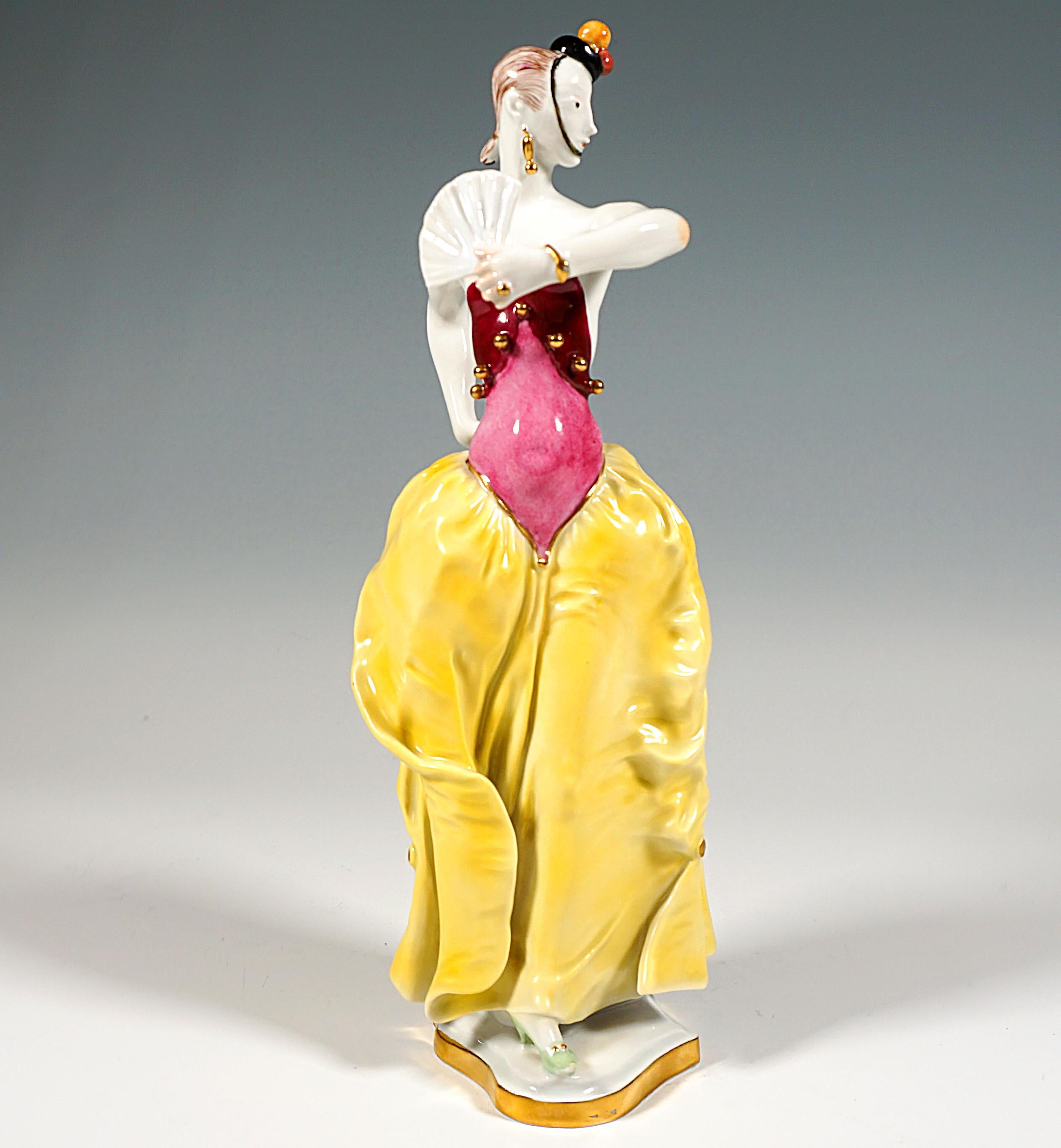 Exceptional Meissen Porcelain Figurine:
Dancer in a skirt puffed out around the hips with a tight, strapless and backless top with golden buttons, posing with a fan and castanet, a small hat with tassels with a hatband resting on her chin pushed low
