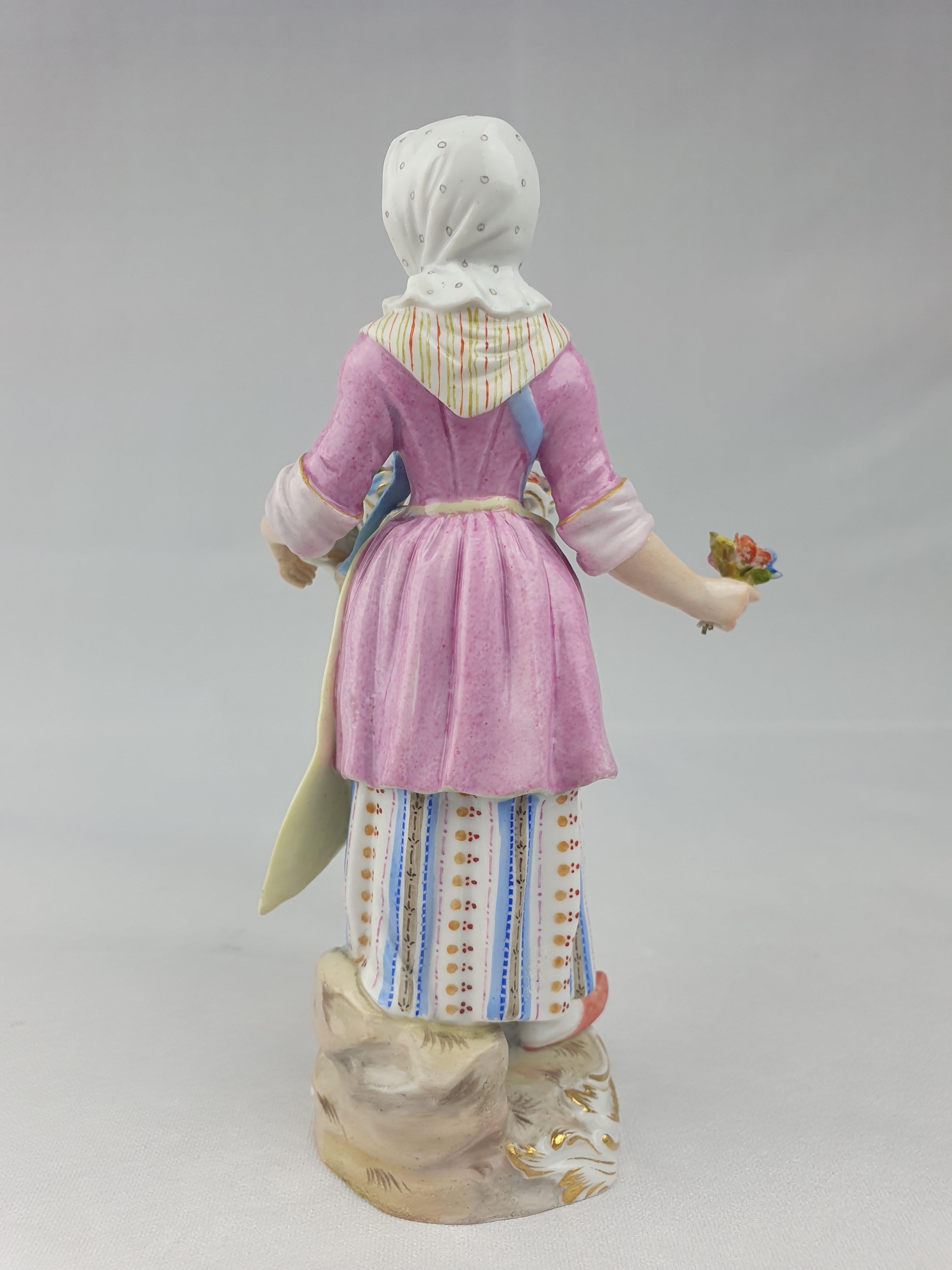 Late 19thc Meissen flower seller from the series of 35 figures known as the Cris of Paris.

Number 16
Height 13.5cm
Cross swords in underglaze blue
Circa 1880.