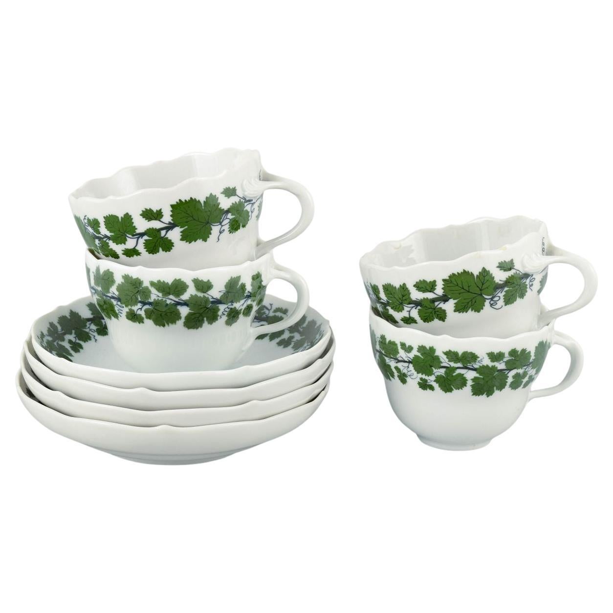 Meissen, four pairs of porcelain cups and saucers, Vine-Leaf Pattern.
