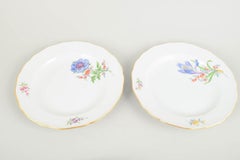 Meissen. Four porcelain dinner plates with floral decorations. Late 19th C.