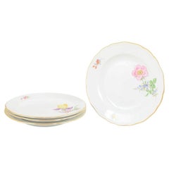 Meissen. Four porcelain dinner plates with floral decorations. Late 19th C.