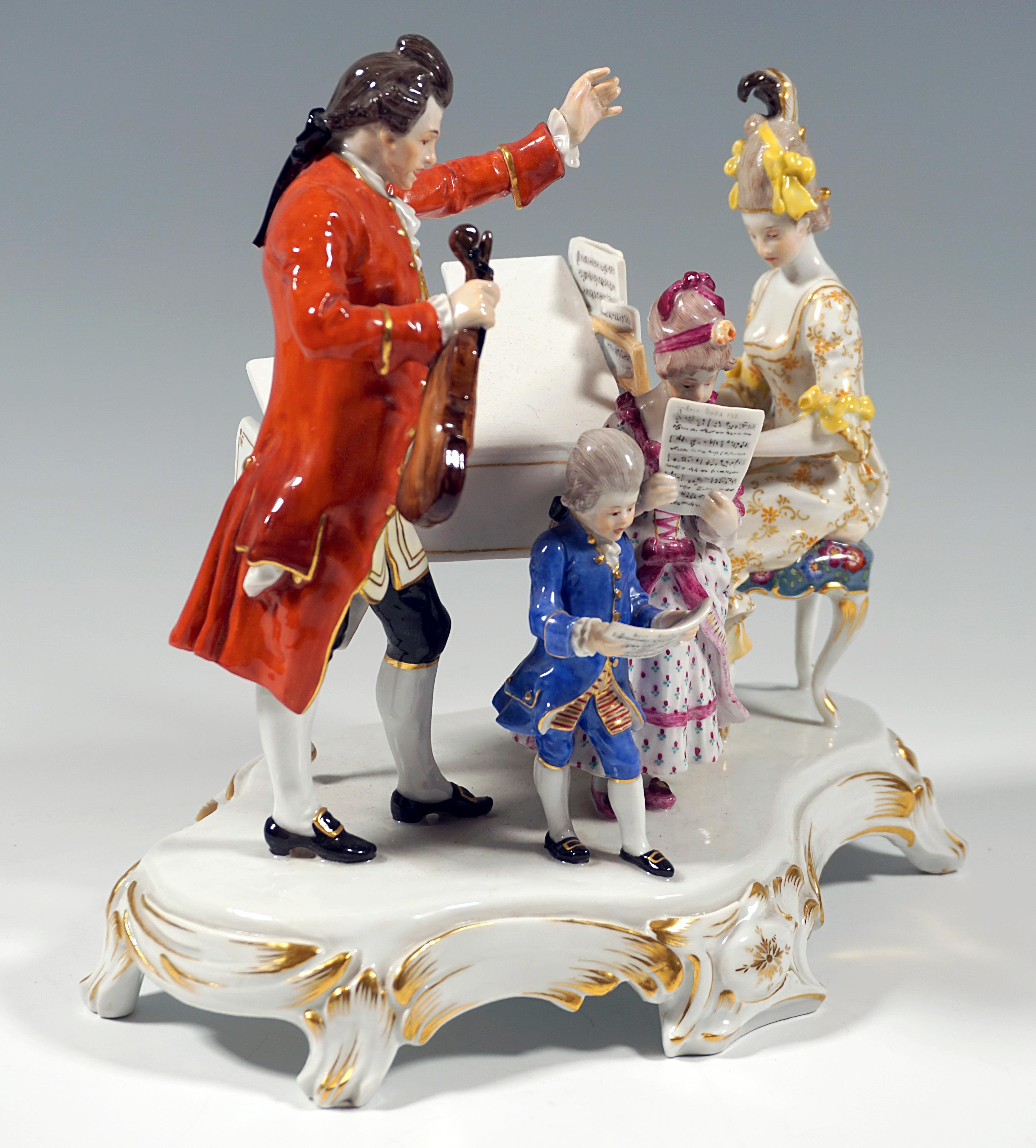 Exceptional Meissen porcelain genre group:
Family group dressed in rococo style playing house music: the mother with a decorated updo in a flowered dress sitting at the piano, the children, girl and boy also finely dressed, holding music sheets in