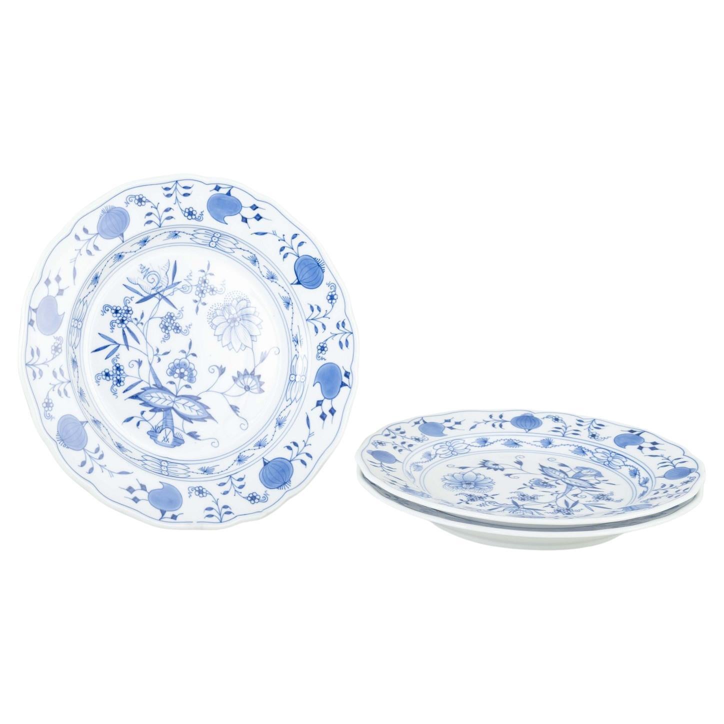 Meissen, Germany. 3 porcelain dinner plates with “Blue Onion” pattern.
