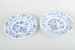 Meissen, Germany. 4 porcelain dinner plates with “Blue Onion” pattern.