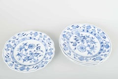 Meissen, Germany. 4 porcelain dinner plates with “Blue Onion” pattern.