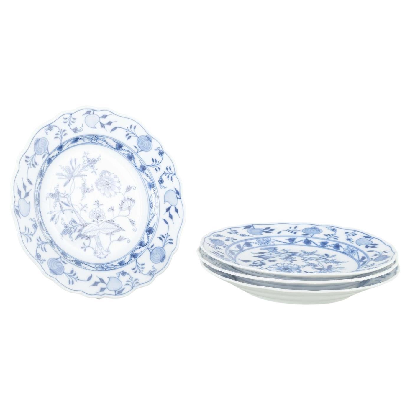 Meissen, Germany. 4 porcelain dinner plates with “Blue Onion” pattern.