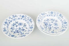Meissen, Germany. 4 porcelain soup plates with “Blue Onion” pattern.