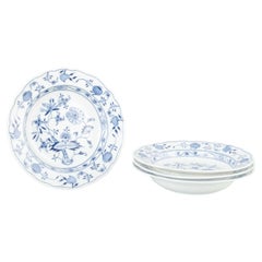 Meissen, Germany. 4 porcelain soup plates with “Blue Onion” pattern.