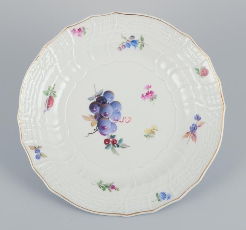 Meissen, Germany. A set of six antique deep porcelain dinner plates. 
Hand-painted with polychrome fruit motifs.
Late 19th century.
Marked.
Third factory quality.
In excellent condition with minimal signs of use.
Dimensions: Diameter 25.0 cm x 3.8