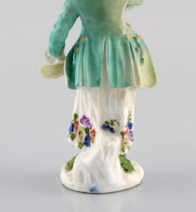 Hand-Painted Meissen, Germany. Antique hand-painted porcelain figure. Lady with flowers.  For Sale