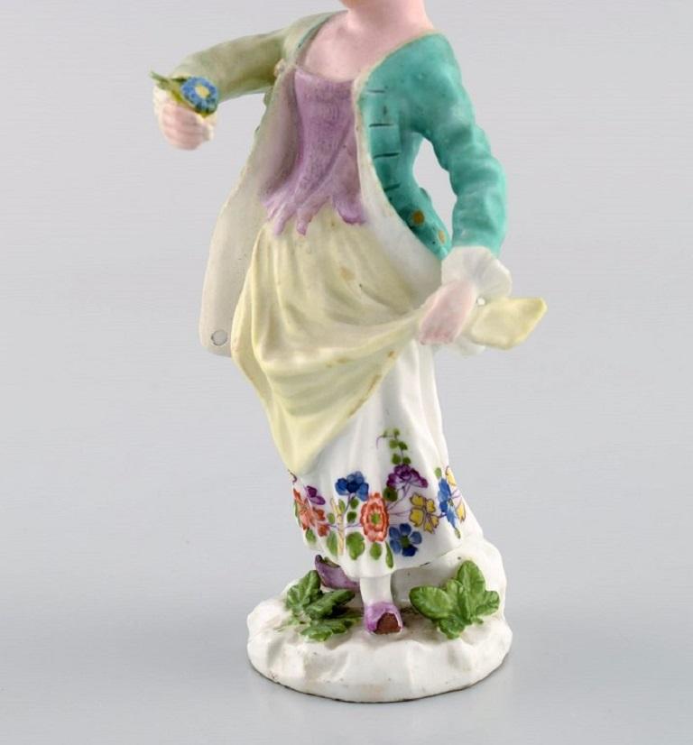 19th Century Meissen, Germany. Antique hand-painted porcelain figure. Lady with flowers.  For Sale