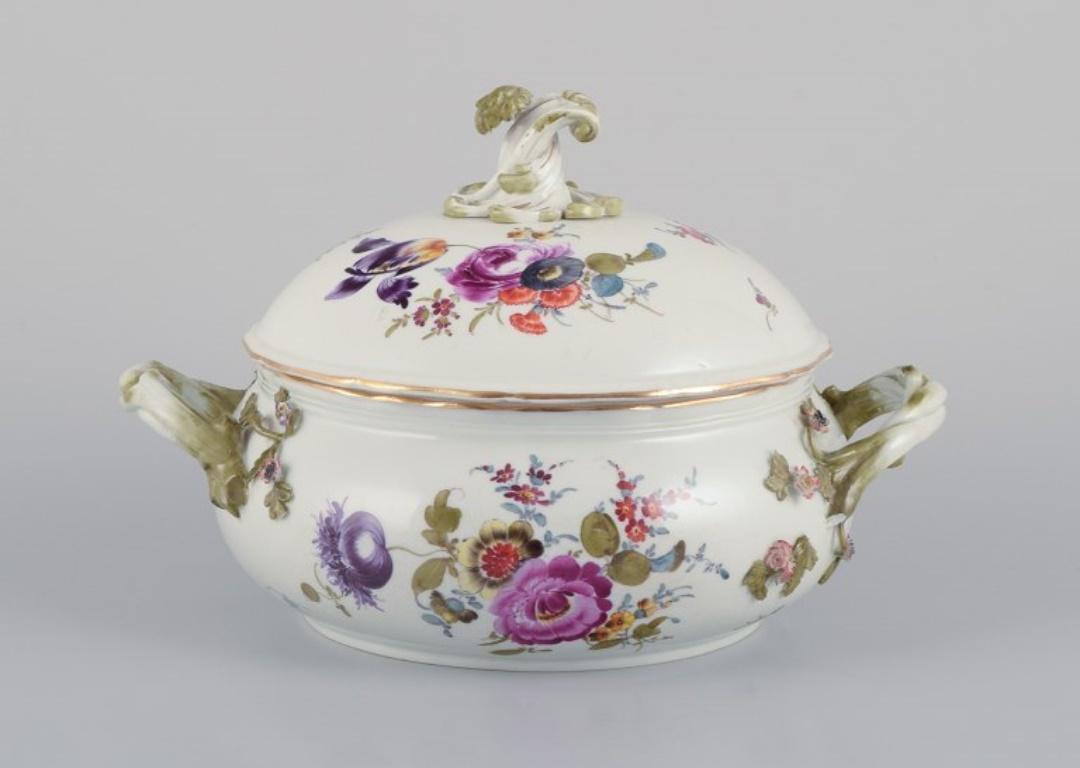 Meissen, Germany. Antique lidded tureen hand-painted with polychrome flowers.
Branch-shaped handles.
Approximately 1800.
In good condition with several chips on the raised flowers and one handle.
Marked.
First factory quality.
Dimensions: Diameter