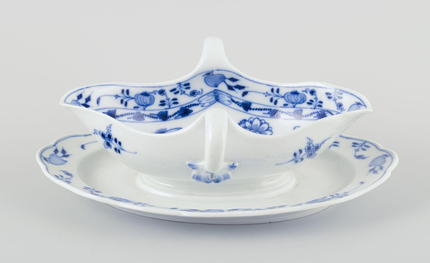 PRE-OWNED GOODS ARE EXEMPT FROM IMPORT TARIFFS FOR U.S., UK, AUSTRALIAN & CANADIAN CUSTOMERS.   
THEREFORE, NO IMPORT TARIFFS WILL BE APPLICABLE TO YOUR PURCHASE. 

Meissen, Germany. Blue Onion porcelain gravy boat with two handles on a