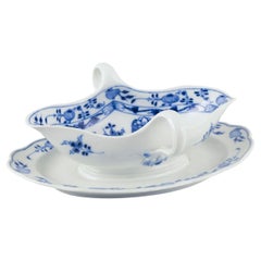 Meissen, Germany. Blue Onion porcelain gravy boat with two handles on a foot.