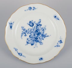 Meissen, Germany. Four antique porcelain plates with blue flowers and insects