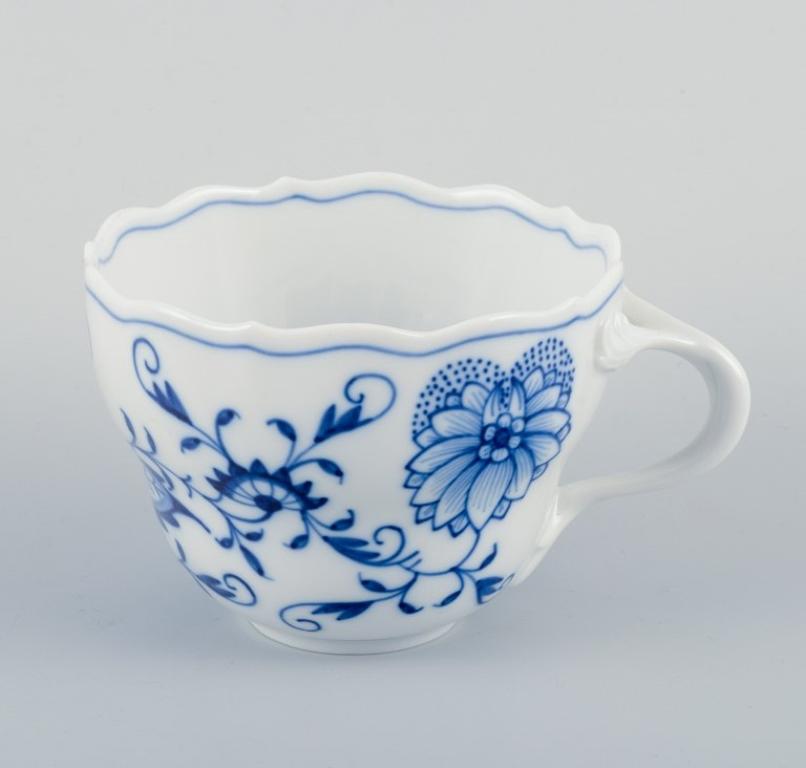 20th Century Meissen, Germany. Four Blue Onion coffee cups with saucers in porcelain. For Sale