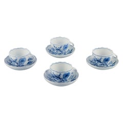 Meissen, Germany. Four Blue Onion coffee cups with saucers in porcelain.