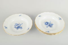 Meissen, Germany. Four deep porcelain plates with floral motifs. Early 20th C.