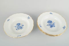 Meissen, Germany. Four deep porcelain plates with floral motifs. Early 20th C.