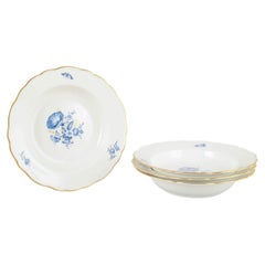 Meissen, Germany. Four deep porcelain plates with floral motifs. Early 20th C.