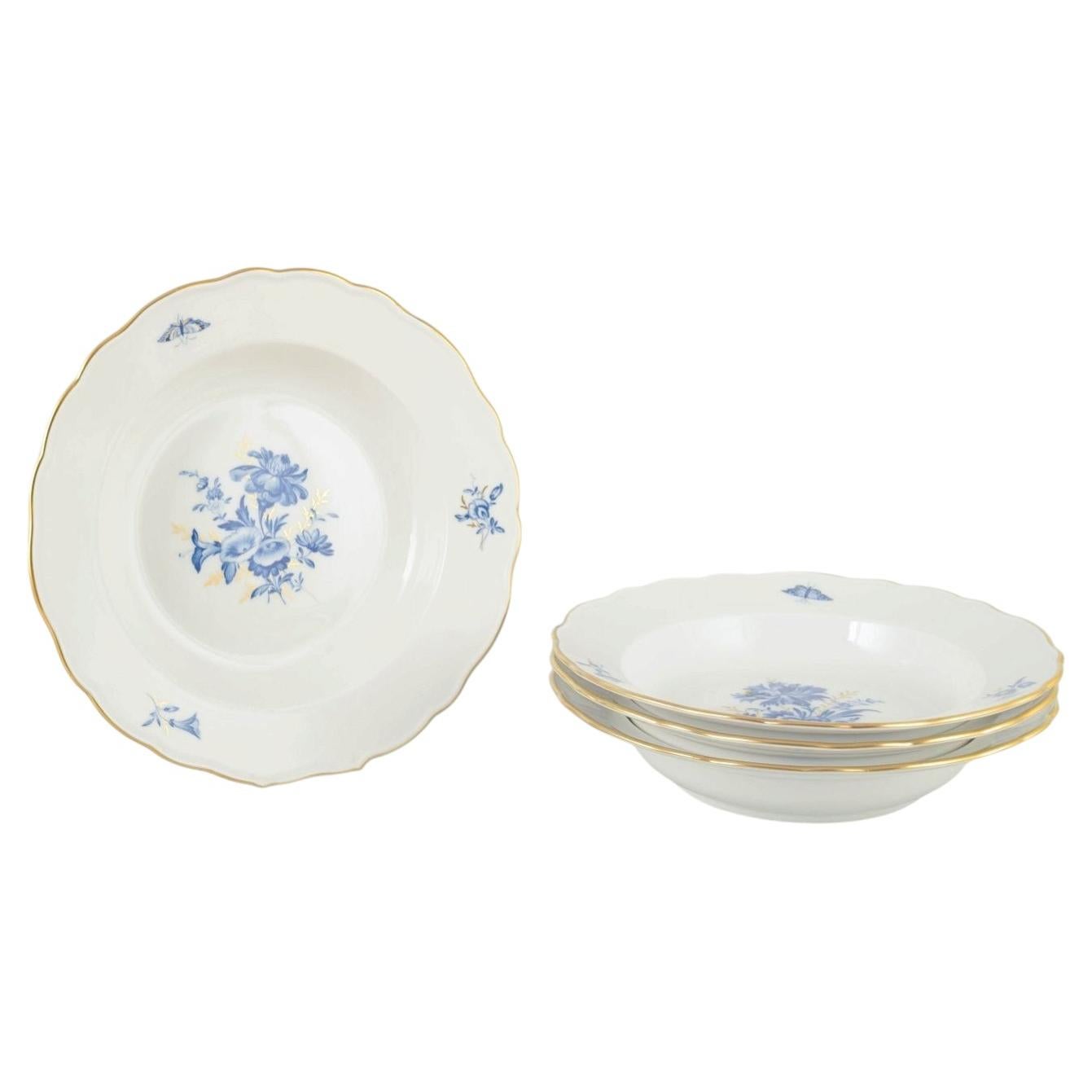 Meissen, Germany. Four deep porcelain plates with floral motifs. Early 20th C.
