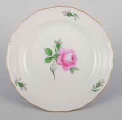 Meissen, Germany. Four lunch plates with a motif of a pink rose.