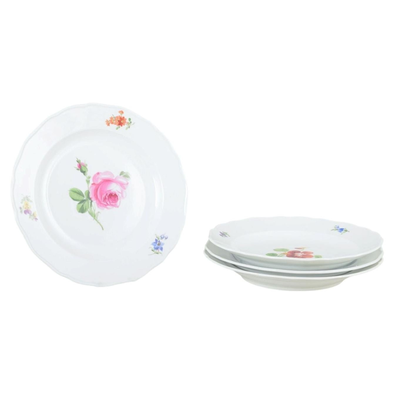Meissen, Germany. Four porcelain plates with floral decoration. Ca 1930s
