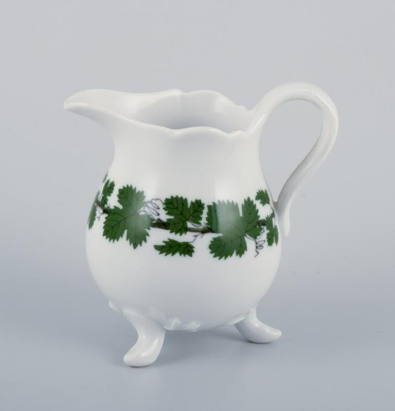 Meissen, Germany, Green Ivy Vine, sugar bowl and creamer. Hand-painted.
Approximately 1930/40s.
Marked.
First factory quality.
In perfect condition.
Creamer: Height 8.0 cm.
Sugar bowl: Height 7.0 cm.