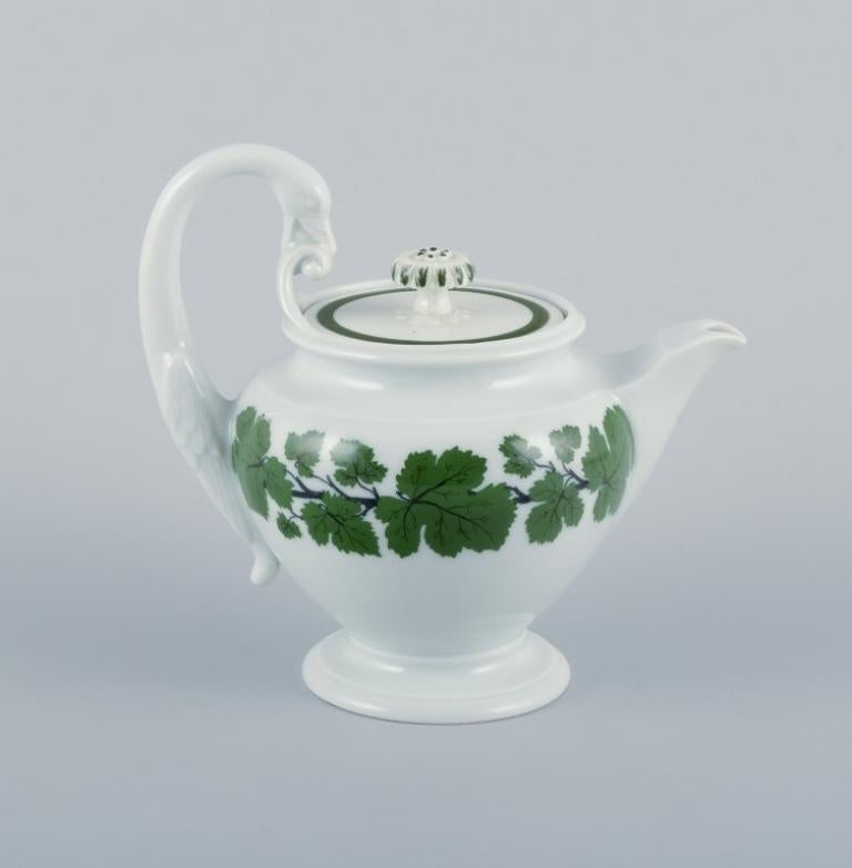 Meissen, Germany, Green Ivy Vine, teapot with swan-shaped handle. 
Hand-painted.
Approximately 1930.
Marked.
First factory quality.
In perfect condition. Appears unused.
Dimensions: Height 16.5 cm including handle x Width 17.5 cm including handle