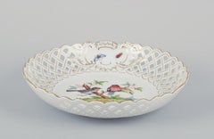 Meissen, Germany. Large open lace porcelain bowl with bird motif and insects