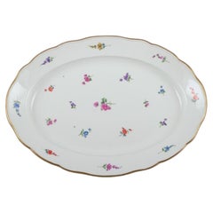 Antique Meissen, Germany, large oval serving platter with polychrome floral motifs.