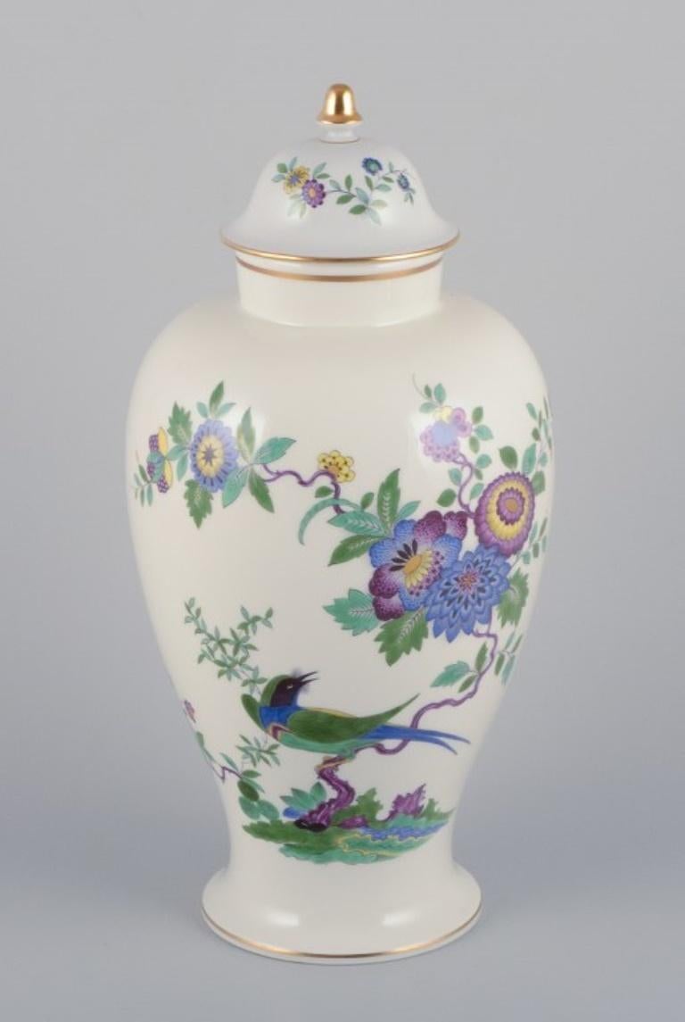 Meissen, Germany, large porcelain lidded jar hand-painted with exotic bird and floral motifs.
Mid-20th century.
Marked.
In perfect condition.
First factory quality.
Dimensions: Height 37.0 cm x Diameter 16.0 cm.