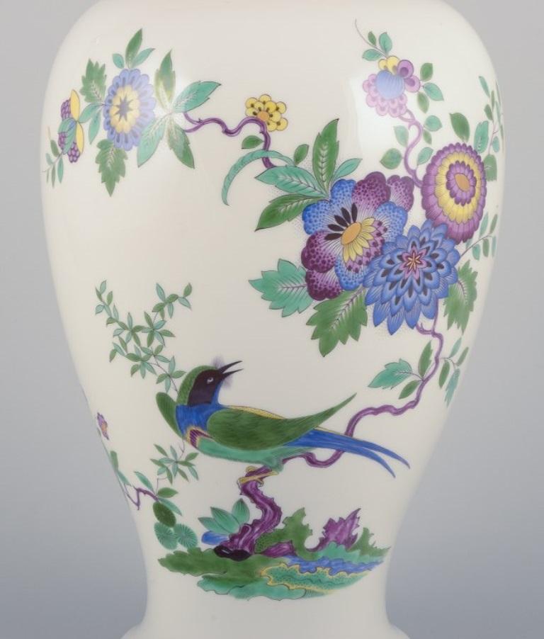 Hand-Painted Meissen, Germany. Large porcelain lidded jar with exotic bird and flowers For Sale