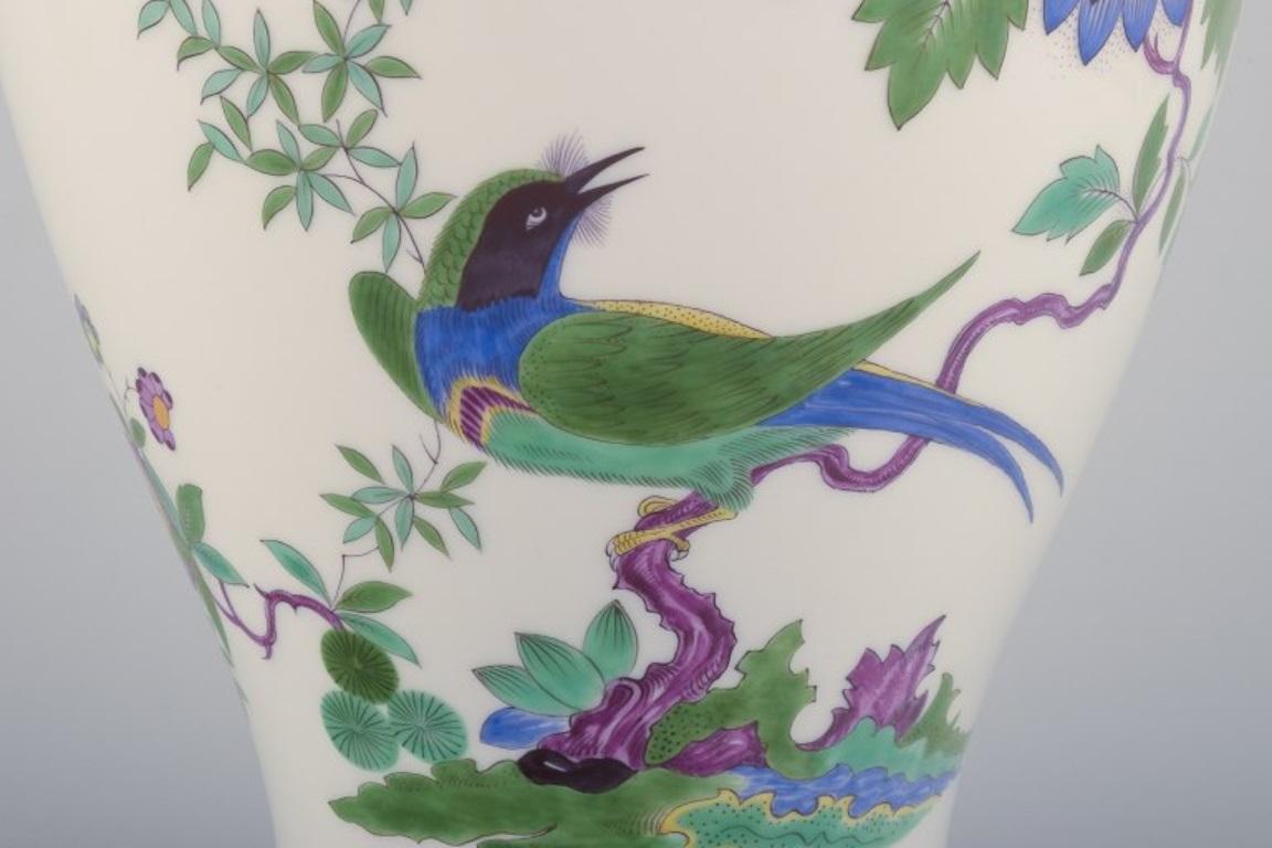 20th Century Meissen, Germany. Large porcelain lidded jar with exotic bird and flowers For Sale