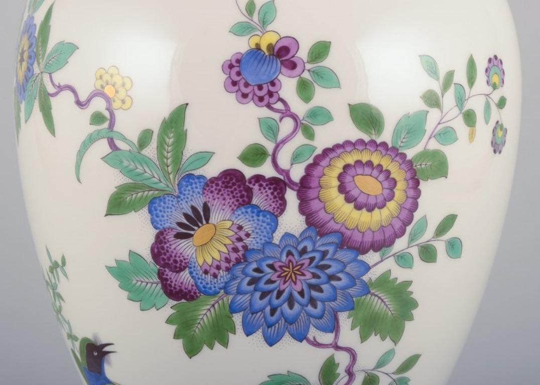 Porcelain Meissen, Germany. Large porcelain lidded jar with exotic bird and flowers For Sale