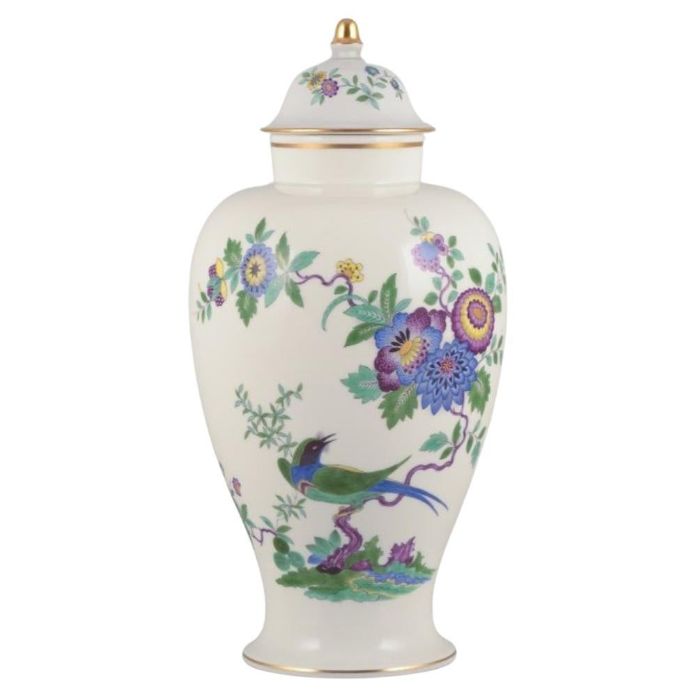 Meissen, Germany. Large porcelain lidded jar with exotic bird and flowers For Sale