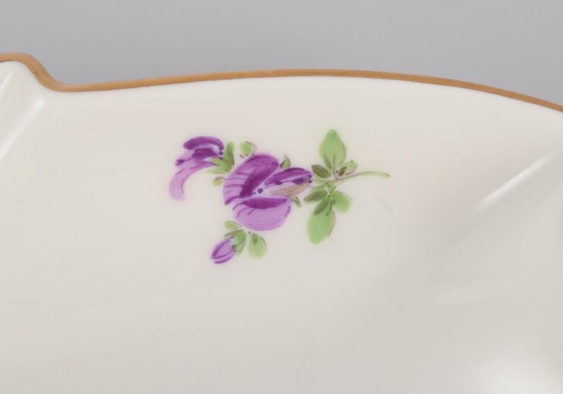 Mid-20th Century Meissen, Germany. Leaf-shaped porcelain dish. Hand-painted with flowers. For Sale