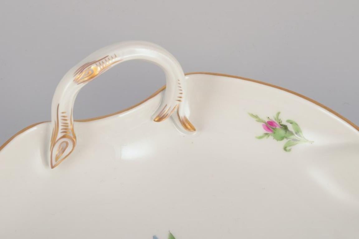 Porcelain Meissen, Germany. Leaf-shaped porcelain dish. Hand-painted with flowers. For Sale