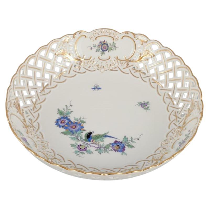 Meissen, Germany. Open lace bowl in porcelain, decorated with exotic bird. For Sale