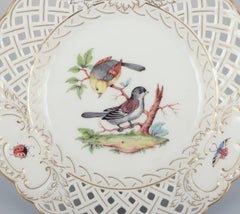 Meissen, Germany. Open lace porcelain plate with bird motif and insects