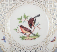 Meissen, Germany. Open lace porcelain plate with bird motif and insects