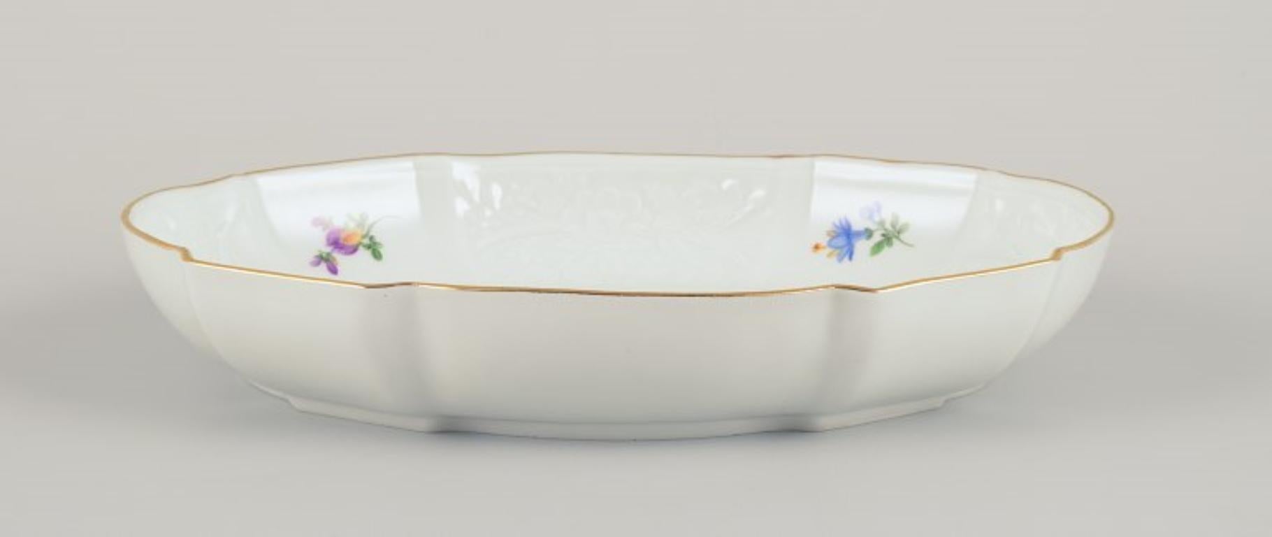 Hand-Painted Meissen, Germany. Oval porcelain bowl hand-painted with polychrome flowers.