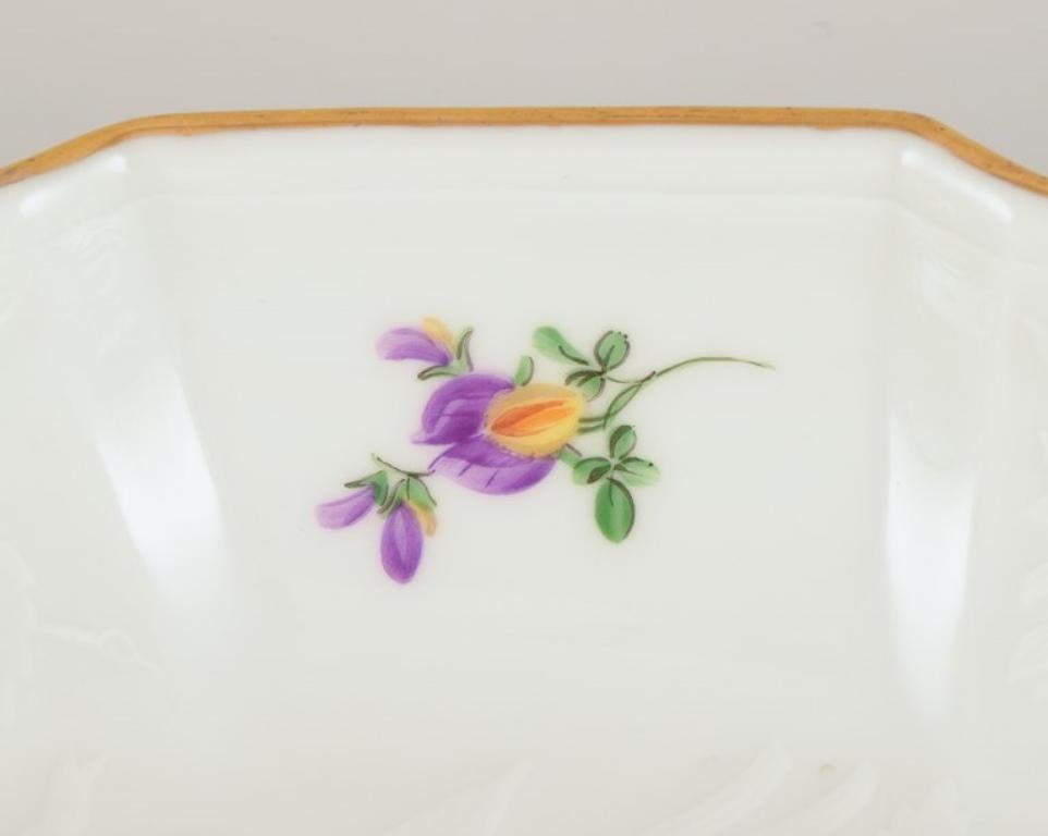 Mid-20th Century Meissen, Germany. Oval porcelain bowl hand-painted with polychrome flowers.