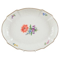 Meissen, Germany. Oval porcelain bowl hand-painted with polychrome flowers. 