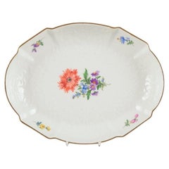 Meissen, Germany. Oval porcelain bowl hand-painted with polychrome flowers.