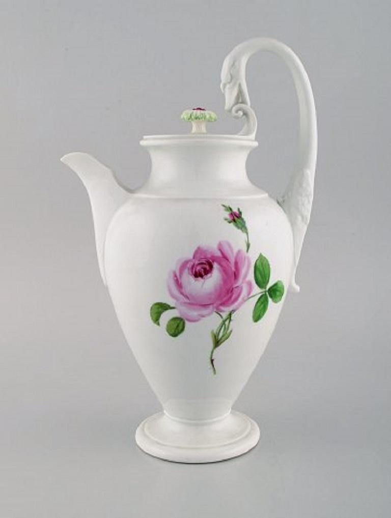 Meissen, Germany. Pink rose coffee service for five people in hand painted porcelain. With coffee pot, cream jug, sugar bowl and plates, early 20th century.
The coffee cup measures: 7 x 6.5 cm.
The saucer measures: 14.5 cm.
The plate measures: