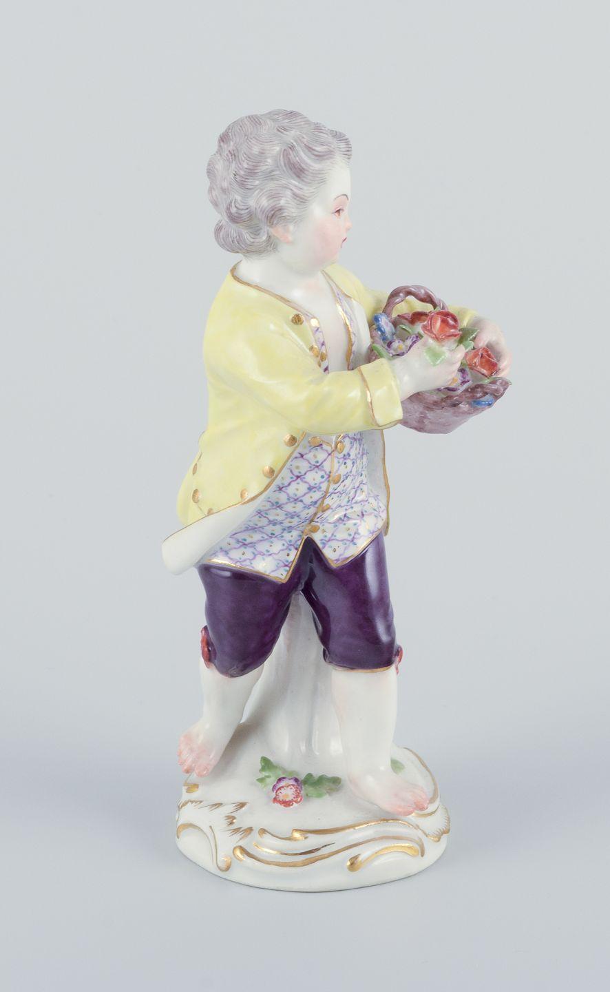Meissen, Germany. Porcelain figurine of boy with basket of flowers. Ca 1900 In Excellent Condition For Sale In Copenhagen, DK