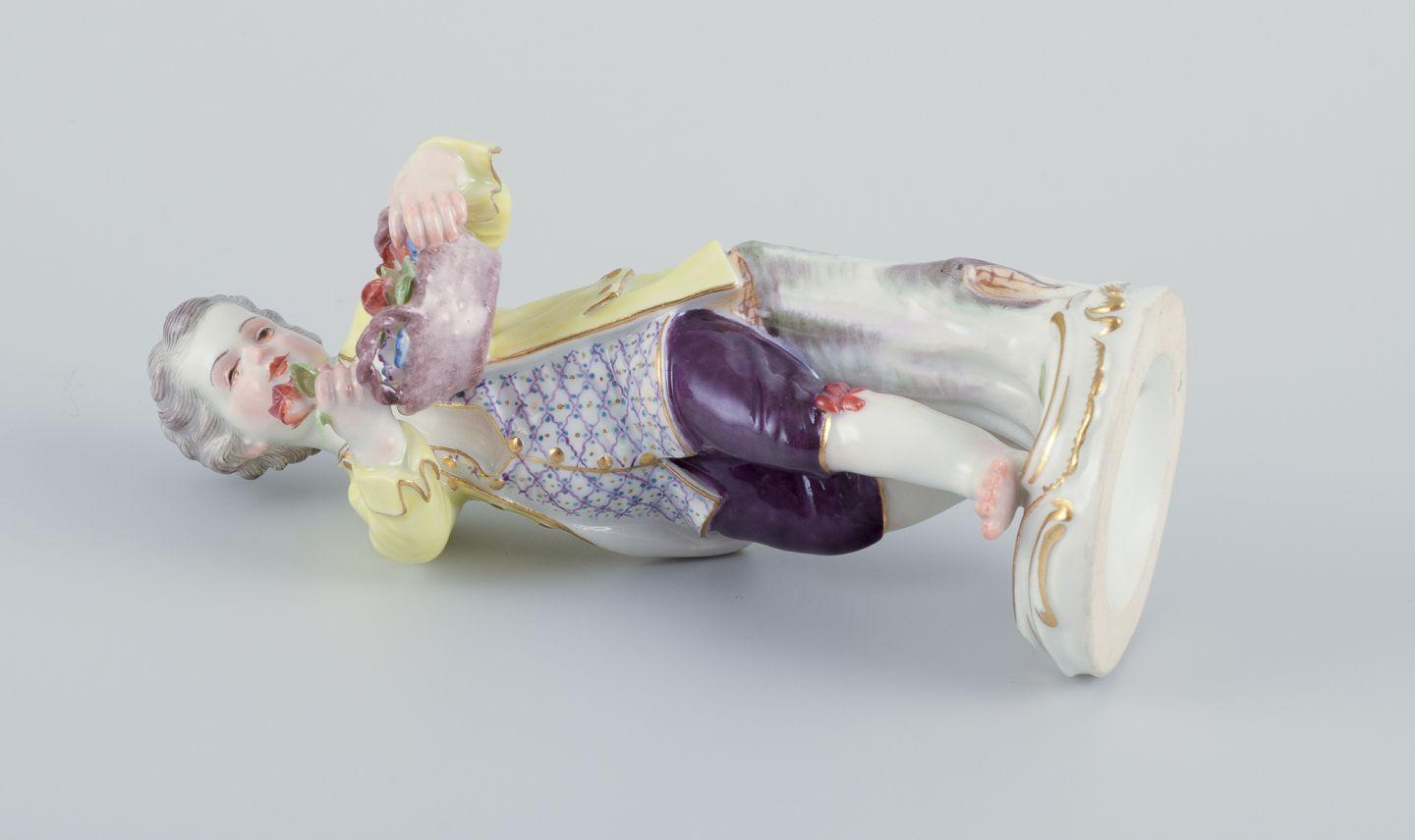 Meissen, Germany. Porcelain figurine of boy with basket of flowers. Ca 1900 For Sale 1
