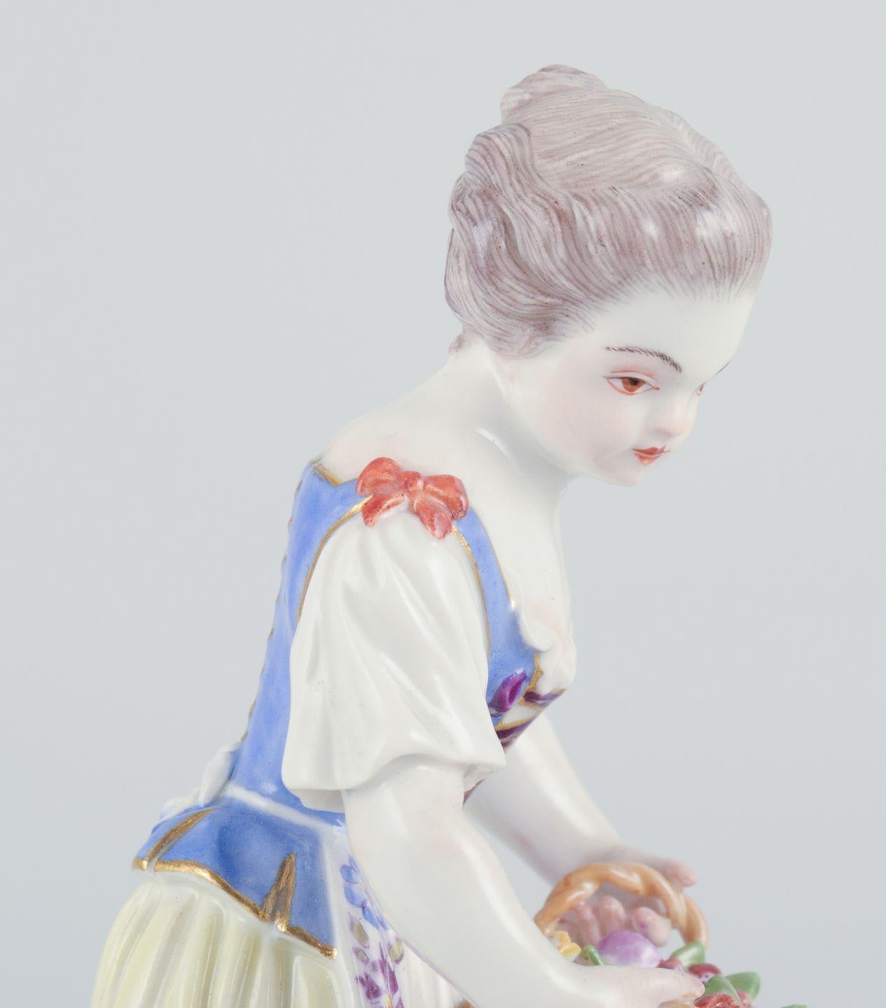 Rococo Revival Meissen, Germany. Porcelain figurine of girl with basket. Ca 1900 For Sale