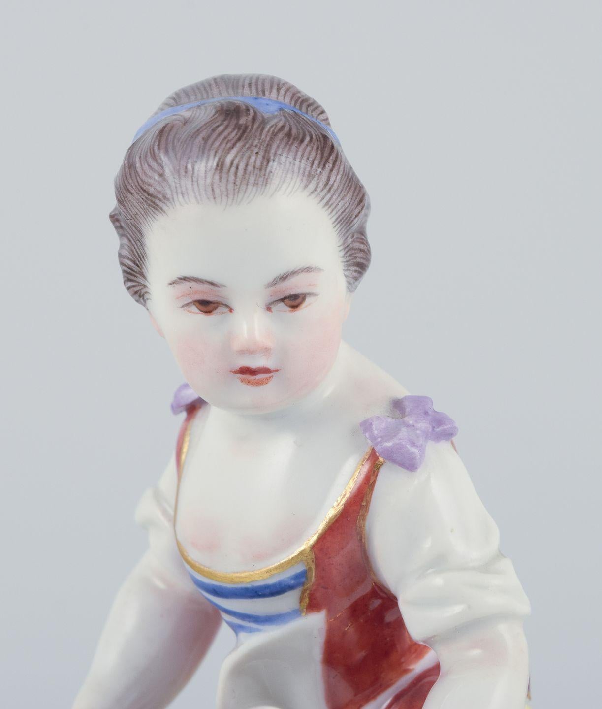 Hand-Painted Meissen, Germany. Porcelain figurine of girl with basket. Ca 1900 For Sale
